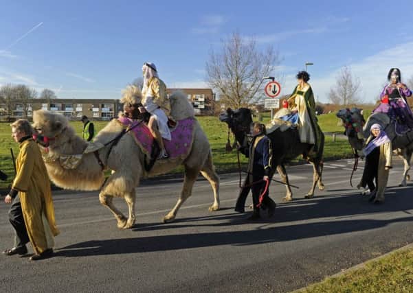 The christmas nativity at St Clare's Church in Warren Park played host to a trio of real camels  
Picture Ian Hargreaves  (161351-5)