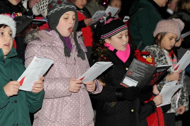 1/12/2014 (MOL) The Schools' Christmas Carol Concert took place on Monday evening in Guildhall Square, Portsmouth. Pictured is: The Schools' Christmas Carol Concert taking place. Picture: Sarah Standing (143423-69) PPP-140112-220251001