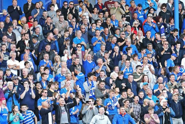 Pompey fans on their feet for the recent game against Doncaster Rovers Picture: Joe Pepler
