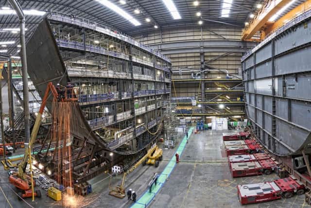 One of our library pictures showing HMS Prince of Wales, the second of the Royal Navy's Queen Elizabeth Class aircraft carriers, has the F and G ring sections joined together at BAE Systems' shipbuilding bay within Portsmouth Naval Base. They are the first of the sections - pre-installed with cabins, engines, cabling and ventilation - to be put together