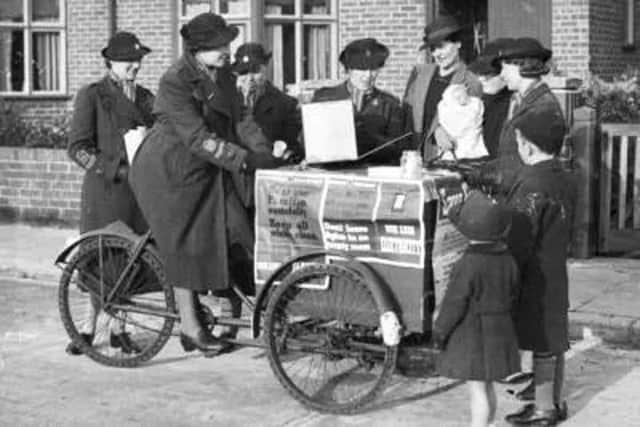 EDUCATE Womens Voluntary Service members on a street fuel drive somewhere in Portsmouth, November 1942