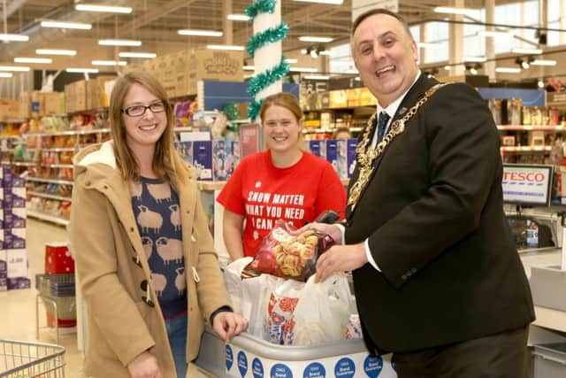 Customer Amy Bond, Tesco community champion Gemma Morrrison and Portsmouth Lord Mayor David Fuller Picture: Habibur Rahman (161567-338)