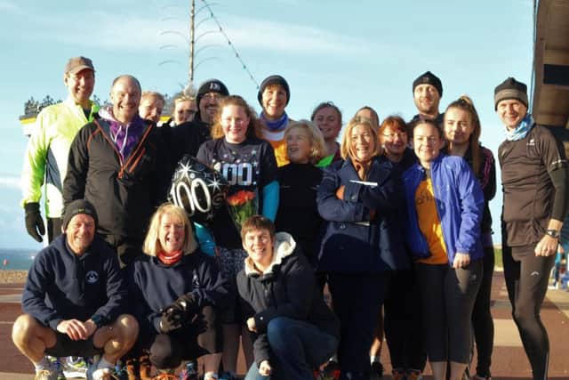 Verity and her friends celebrate her 100th parkrun. Picture: David Brawn