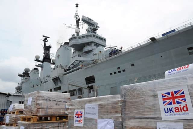 HMS Illustrious arriving in Singapore to deliver aid. Picture: Ray Jones PPP-150129-132325001