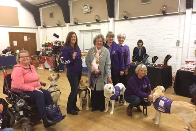 Members of the Fareham support group for Canine Partners are wowed by the dogs skills