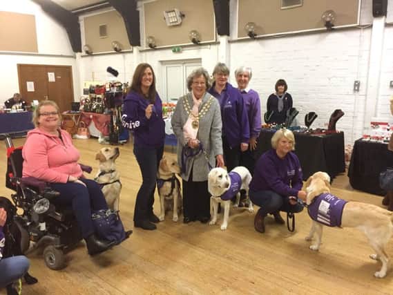 Members of the Fareham support group for Canine Partners are wowed by the dogs skills
