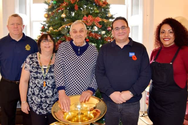 Left to right - Colour Sergeant Andrew Laishley, care home manager Viv Coombs, Clive Pearce, Ashley Vingoe, Royal British Legion case officer for the Isle of Wight, Hampshire and Dorset, and carer Kerry Hall
