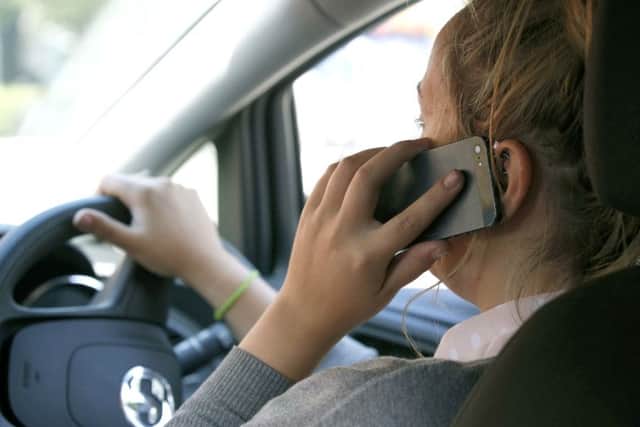 A driver on a mobile phone  - picture posed by model
