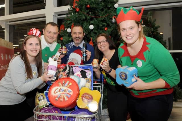 From left, Tesco Fratton's clothing manager Philippa Smith, fresh lead Ryan Faulkner, store manager Jon Roberts, customer services manager Sally Noice and community champion Gemma Morrison Picture: Sarah Standing (161624-8392)