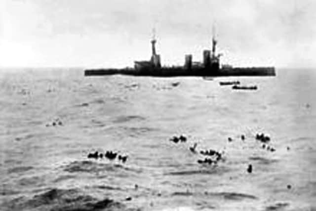 The battle cruiser HMS Inflexible picks up survivors from the German armoured cruiser Gneisenau