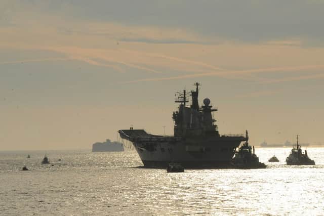 The former HMS Illustrious leaving Portsmouth for the final time Picture: Sarah Standing (161622-4655)