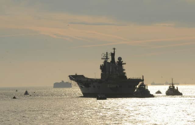 The former HMS Illustrious leaving Portsmouth for the final time Picture: Sarah Standing (161622-4655)