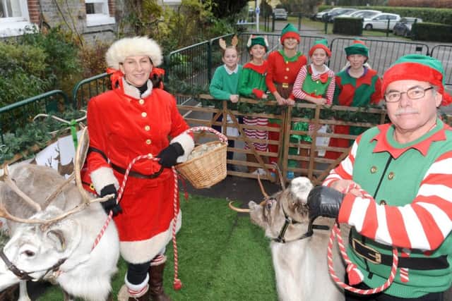'Miss Claus' and Father Christmas's oldest elf with (back l-r) Coco McElligott-Smeed (10), Izzy Faithfull (10), Maddy Peel (11), Charlotte Jordan (10) and George Falcon-Paterson (10)