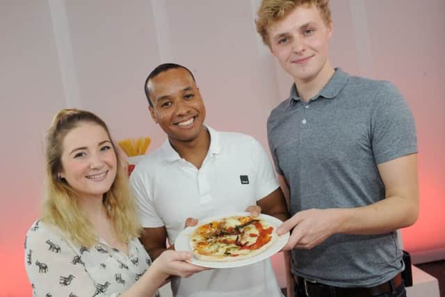 Former Great British Bake Off contestant Enwezor Nzegwu with students Abby Burnett (21) and Tobias Woodward (20)