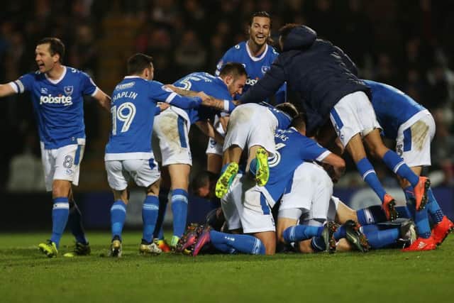 The Pompey players celebrate Kal Naismith's winner Picture: Joe Pepler