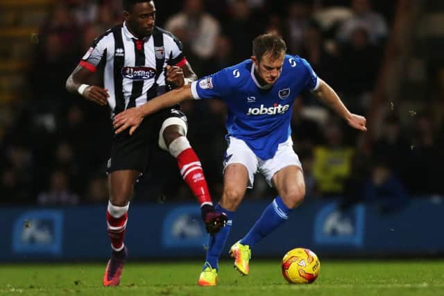 Matt Clarke in command for Pompey against Grimsby. Picture: Joe Pepler