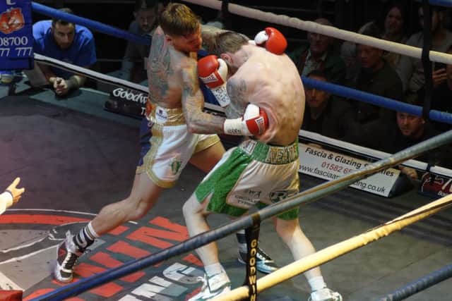 Joel McIntyre dishes out some punishment to Miles Shinkwin. Picture: Neil Marshall