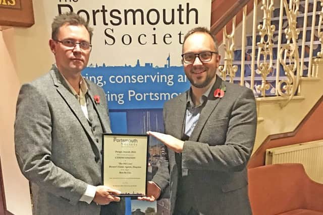 Daryn Brewer of Brewers, left, and James Bengree from McAndrew Martin with the award