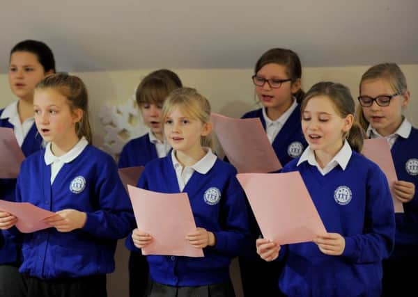 Children from Padnell Junior School singing Christmas carols for the volunteers at the Rowans Hospice. Front from left, Imogen Collen, 10, Olivia Fowler, 10, and Emma Pinhorne, 10

Picture: Sarah Standing (161633-4761)