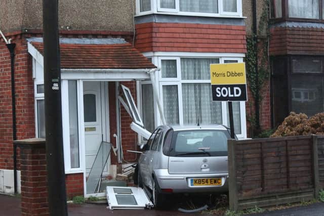 The scene at Silvester Road this morning after a silver Vauxhall Corsa crashed into a semi-detached house
