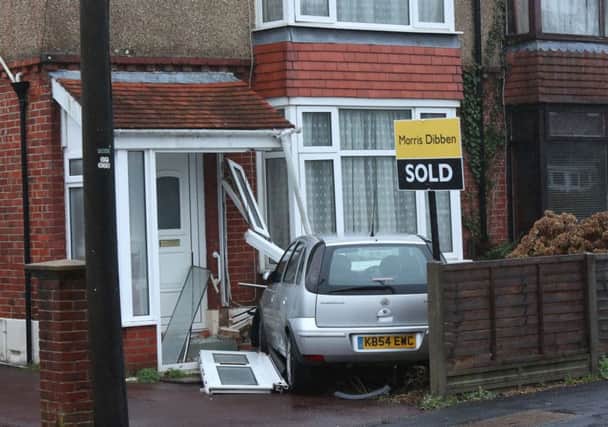 The scene at Silvester Road this morning after a silver Vauxhall Corsa crashed into a semi-detached house