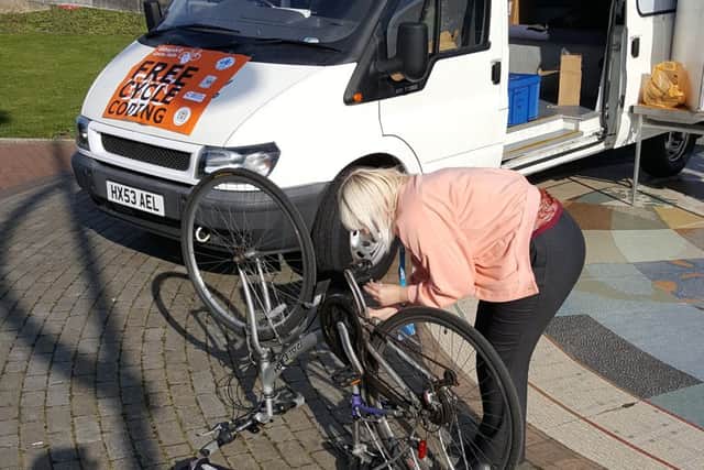 A cyclist keen to keep hold of their wheels, takes their bike to a previous cycle safety event