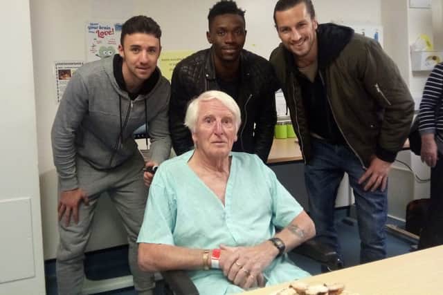 Patient Sydney Baker with Pompey players, from left, Enda Stevens, Amine Linganzi and Christian Burgess
Picture: Ellie Pilmoor