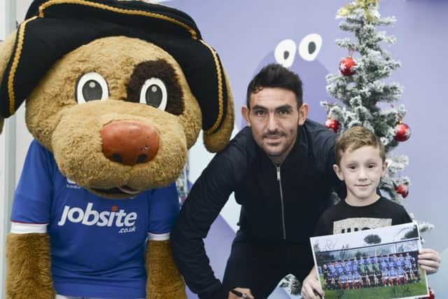 From left, Nelson the mascot, Pompey's Gary Roberts, and Jude Allen, six, at Queen Alexandra Hospital in Cosham