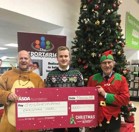 Malcolm Dent, Gosprotarian chairman, Scott Allam, ASDA Gosport manager, and Gosport Rotary president Simon Mason