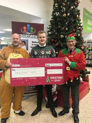 Malcolm Dent, Gosprotarian chairman, Scott Allam, ASDA Gosport manager, and Gosport Rotary president Simon Mason