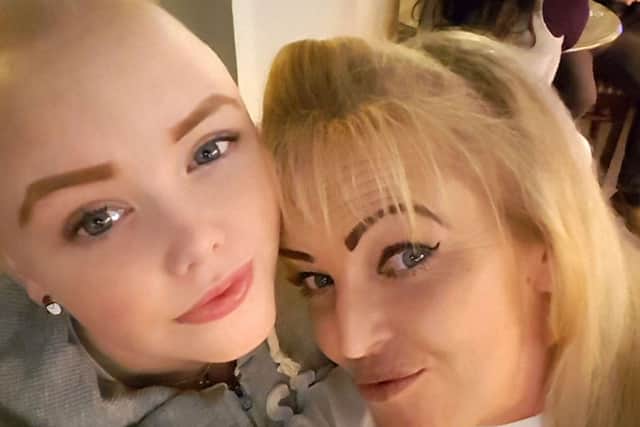 Saraya Jeffery, 14, from Buckland, shows off her new look with her mother Lorraine after having her head shaved