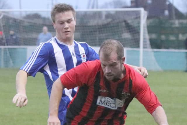 Leigh Shadbolt, right, on the ball for Fareham against Cowes Sports. Picture: Habibur Rahman
