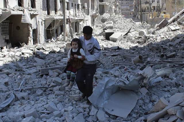 FILE -- In This April 21, 2014, file photo, provided by the anti-government activist group Aleppo Media Center (AMC), which has been authenticated based on its contents and other AP reporting, shows a Syrian man holding a girl as he stands on the rubble of houses that were destroyed by Syrian government forces air strikes in Aleppo, Syria. The implosion of diplomatic talks with Russia has left the Obama administration with a series of bad options for what to do next in Syria. Despite harrowing scenes of violence in Aleppo and beyond, President Barack Obama is unlikely to approve any risky new strategy before handing the civil war over to his successor early next year.(AP Photo/Aleppo Media Center AMC, File) YPN-161210-081432060