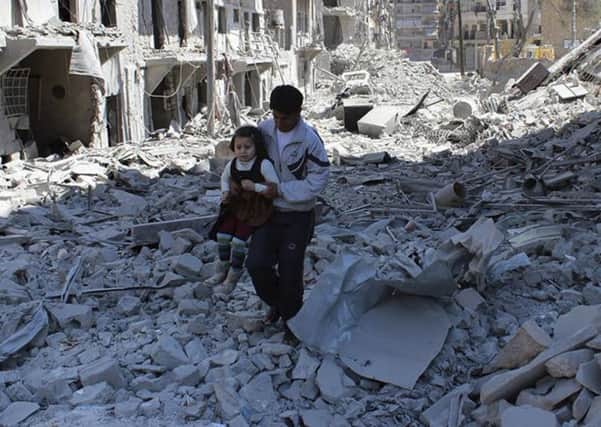 FILE -- In This April 21, 2014, file photo, provided by the anti-government activist group Aleppo Media Center (AMC), which has been authenticated based on its contents and other AP reporting, shows a Syrian man holding a girl as he stands on the rubble of houses that were destroyed by Syrian government forces air strikes in Aleppo, Syria. The implosion of diplomatic talks with Russia has left the Obama administration with a series of bad options for what to do next in Syria. Despite harrowing scenes of violence in Aleppo and beyond, President Barack Obama is unlikely to approve any risky new strategy before handing the civil war over to his successor early next year.(AP Photo/Aleppo Media Center AMC, File) YPN-161210-081432060