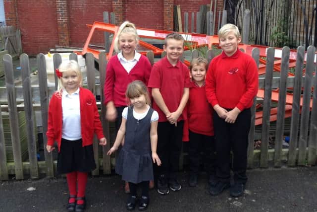 Children from Haselworth Primary by their adventure playground