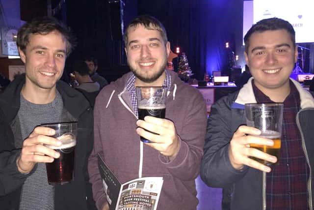 From left, University of Portsmouth students Clement Dallard, from France, Phil Lentz, from Denmead and Jake Smith, from Essex, at the Portsmouth Beer Festival Picture:Loughlan Campbell