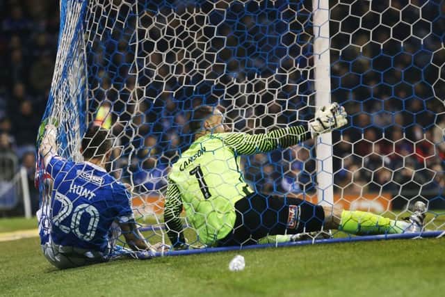 Noel Hunt ends up in the back of the net alongside Trevor Carson as Pompey went in search of the breaktrhough against Hartlepool Picture: Joe Pepler