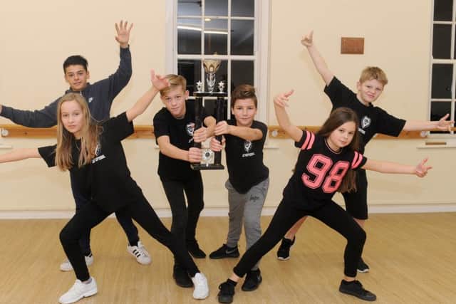 The Dirty Knees Crew from Sychronize Hip Hop School in Gosport, came first place in the Best Under 12s team at the 101 Events UK Street Dance Championships. Back from left, Kieas James, 12, Tommy Austen, 11, McKenzie Wright, 10, and Dylan Kelson, 11, with from from left, Amy Butler, 12, and Megan Thornley, 11 Picture: Sarah Standing (161621-8201)