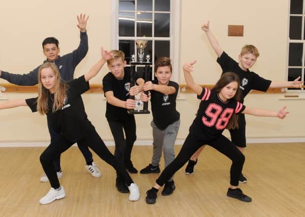 The Dirty Knees Crew from Sychronize Hip Hop School in Gosport, came first place in the Best Under 12s team at the 101 Events UK Street Dance Championships. 

Back from left, Kieas James, 12, Tommy Austen, 11, McKenzie Wright, 10, and Dylan Kelson, 11, with from from left, Amy Butler, 12, and Megan Thornley, 11 

Picture: Sarah Standing (161621-8201)