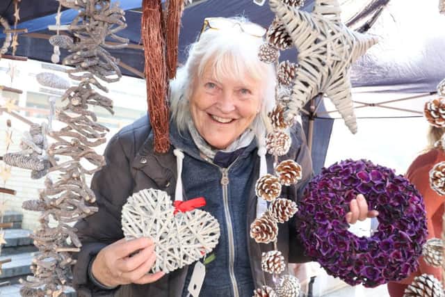 Jan Copsey selling nature-inspired Christmas decorations Picture: Habibur Rahman (161676-605)