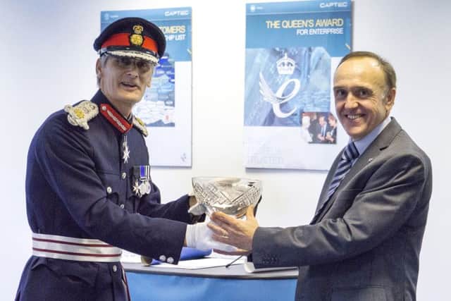 Lord-Lieutenant of Hampshire Nigel Atkinson presents the award to Captec managing director and founder Professor Max Toti
