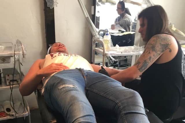 Lee Collier-Williams getting a tattoo