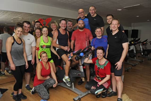 Ralph Swan, on the bike, and his daughter Carole McCullagh take part in a cyclethon at Roko in aid of Queen Alexandra Hospital in Cosham
Picture: Ian Hargreaves (161360-2)