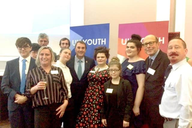 Volunteers from Gosports Loud and Proud at the UK Youth Awards with Nigel Mansell, centre