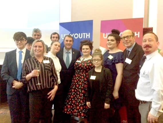 Volunteers from Gosports Loud and Proud at the UK Youth Awards with Nigel Mansell, centre