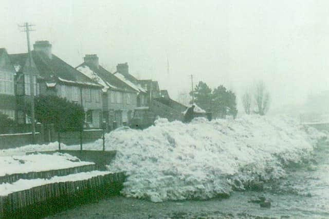 A city council lorry dumping snow from Portsmouth streets in Portcreek, Cosham, December 1962.