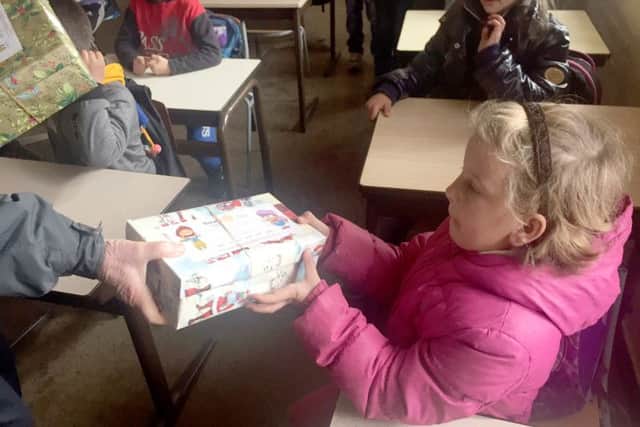 Delighted tot is given her gift