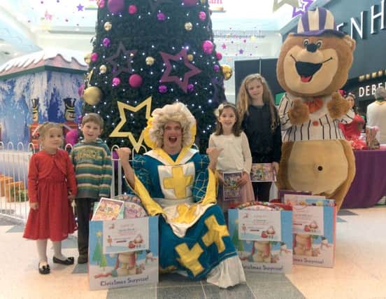 Winner Emilie-May Clifton, with brother Oskar, Mark Siney as Nurse Nellie, winner Lily Thompson and third winner Ruby-Mae Puddick, Fareham Shopping Centres Toffee Bear and their bags of toys