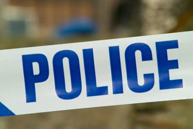 Police have been called to a car on a train line between Brighton and Portsmouth