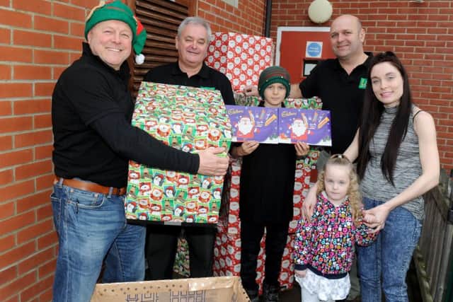 From left, Mick Balch, Paul Harris, William Balch and Steve Kibbey from L&S Waste Management with Catherine Booth House resident Jade Emptage, 22, and her daughter Scarlett-Rose Almy, three
Picture: Sarah Standing (161719-9854)